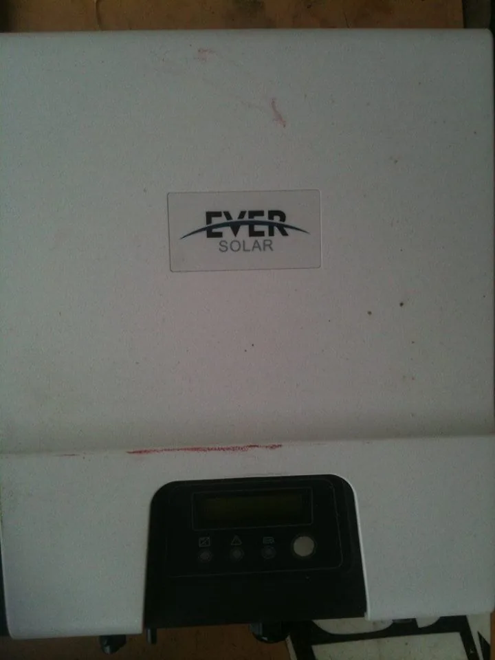 A white solar inverter with its display panel